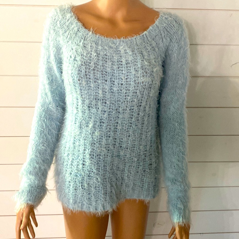 Light blue sweater. Size L. Worn only a few times.